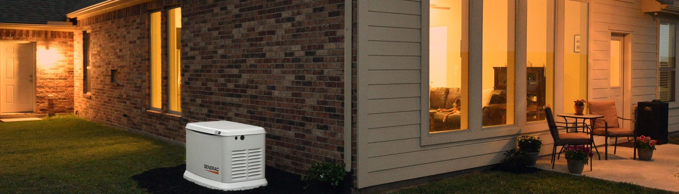 Generac home standby generator beside a New England home